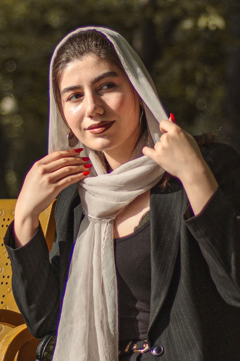 Young woman wearing a headscarf and blazer outdoors