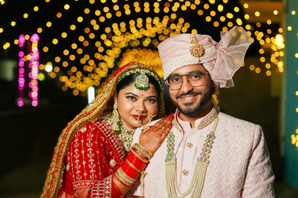 A bride and groom posing for a picture