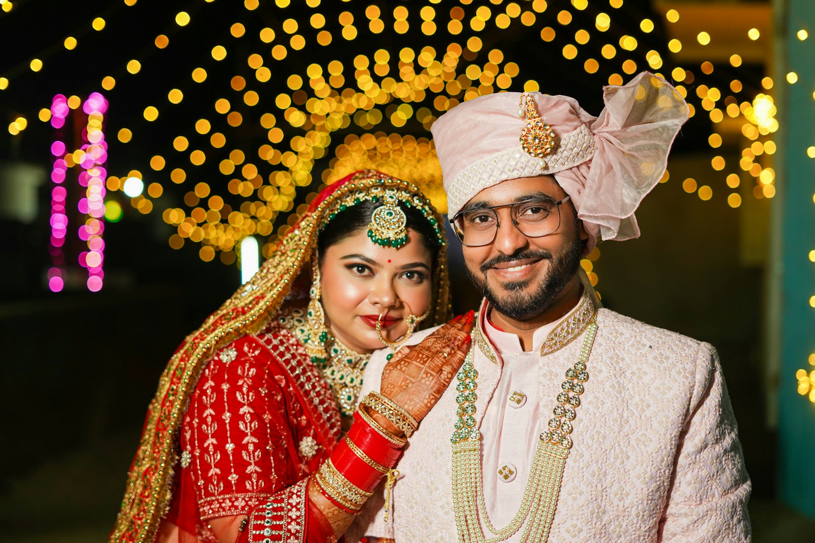 A bride and groom posing for a picture
